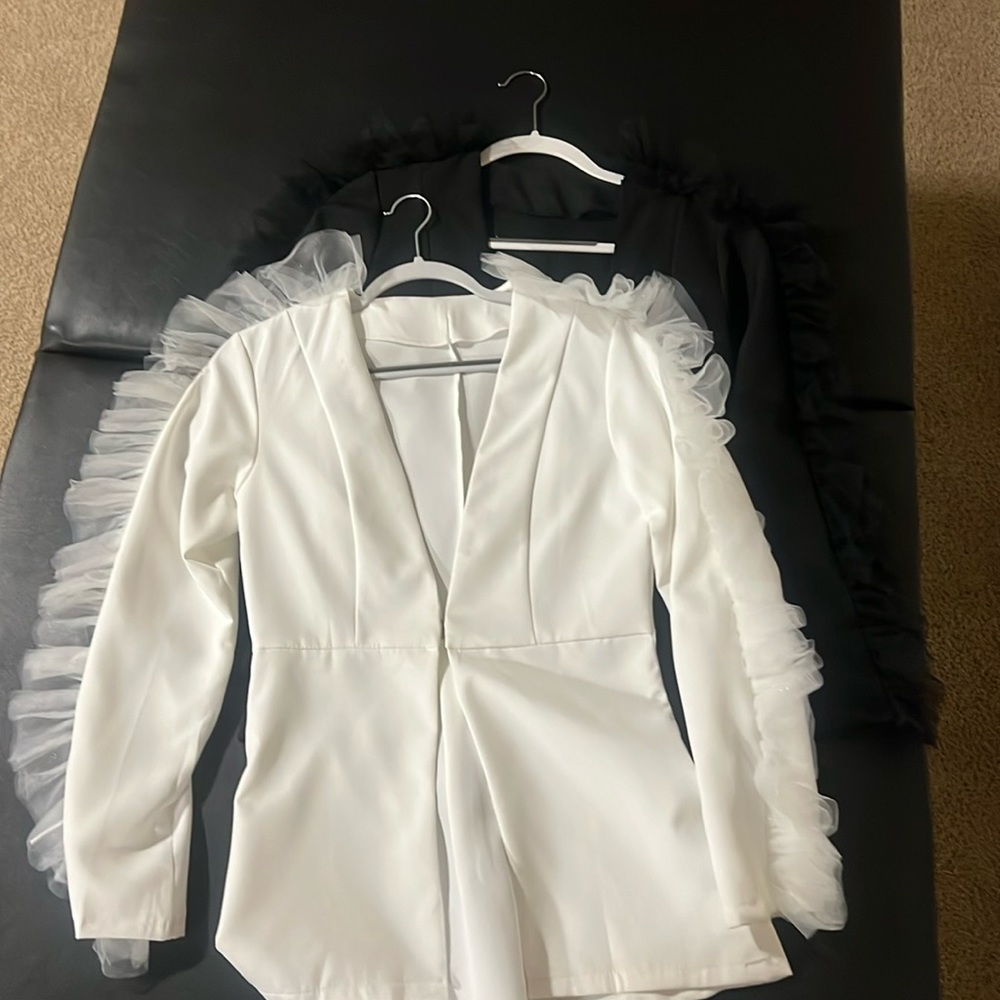 White and black tulle sleeve accent jackets with a clasp closure in front